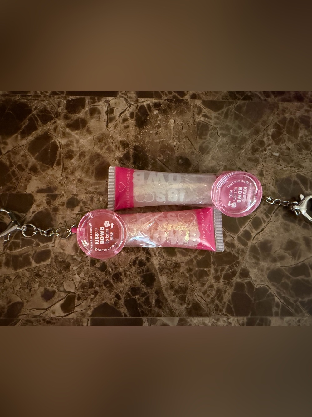 Glamour Kiss Bomb Sheer Pink Lip Gloss Tubes with Gold Glitter